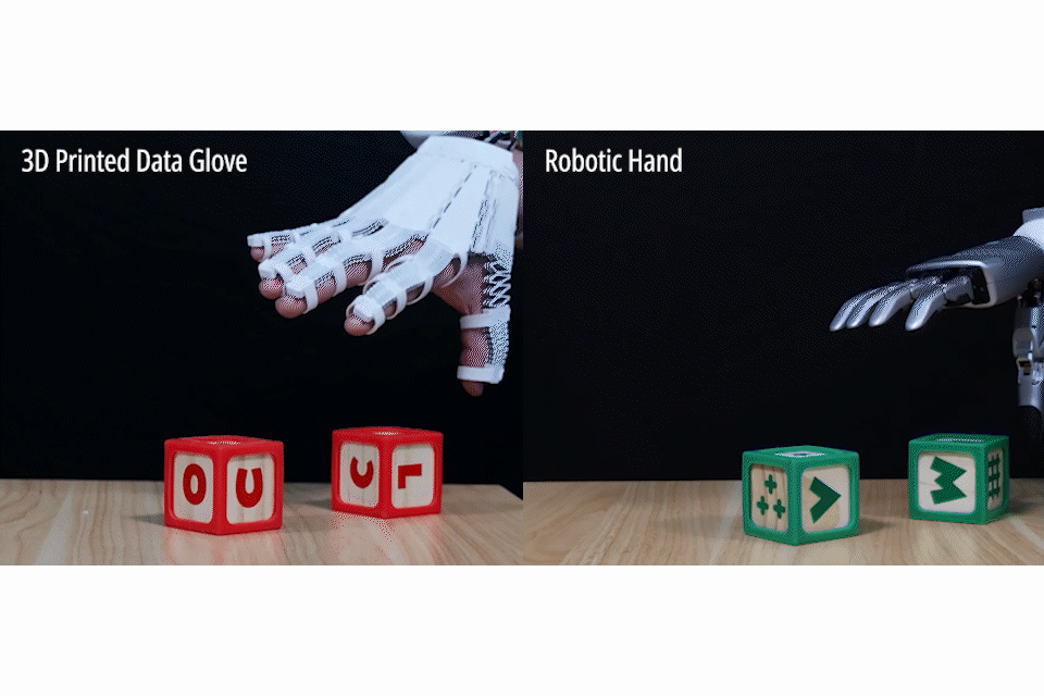 X-Hinges researchers' demonstration pairs a printed sensing glove with a robotic hand moving toy blocks.