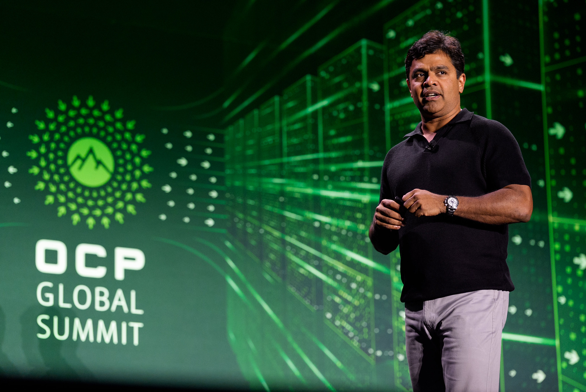 Santosh Janardhan speaking onstage at the OCP Global Summit, from Meta’s event account.